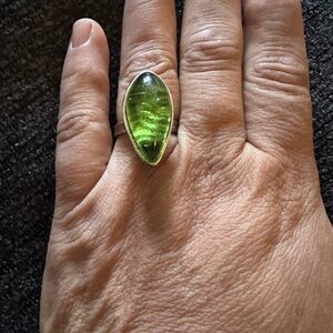 Vintage lucite ring.   Set in a silver toned ring. Adjustable